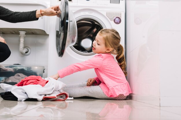 Girl Sitting On Washing Machine